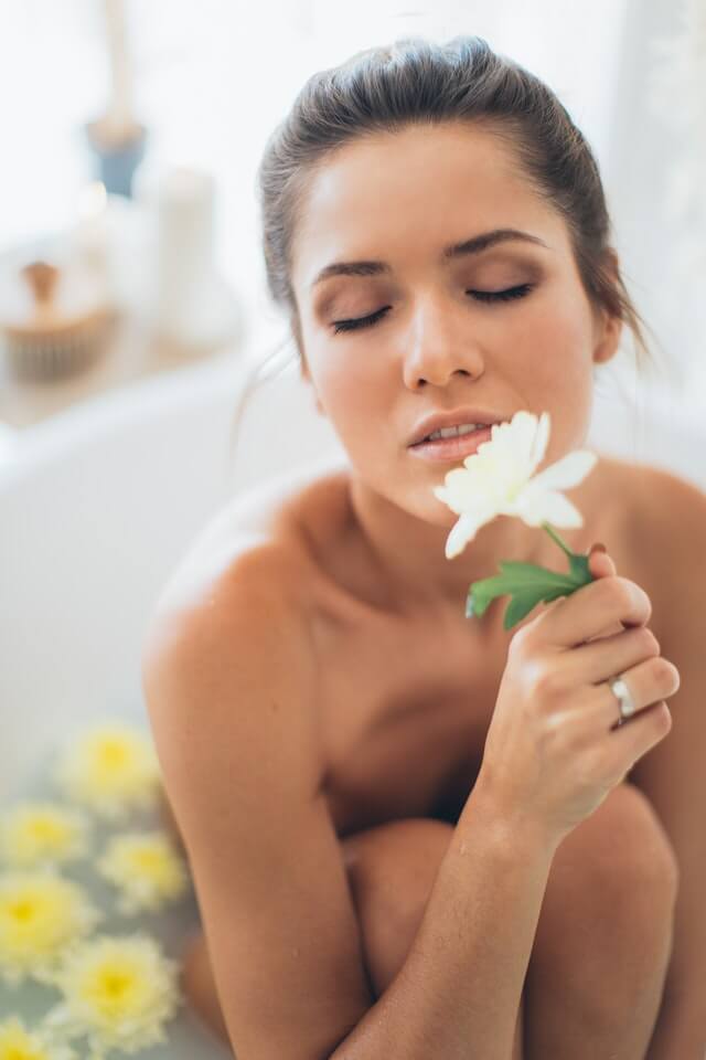 afterbath-woman-holding-flower